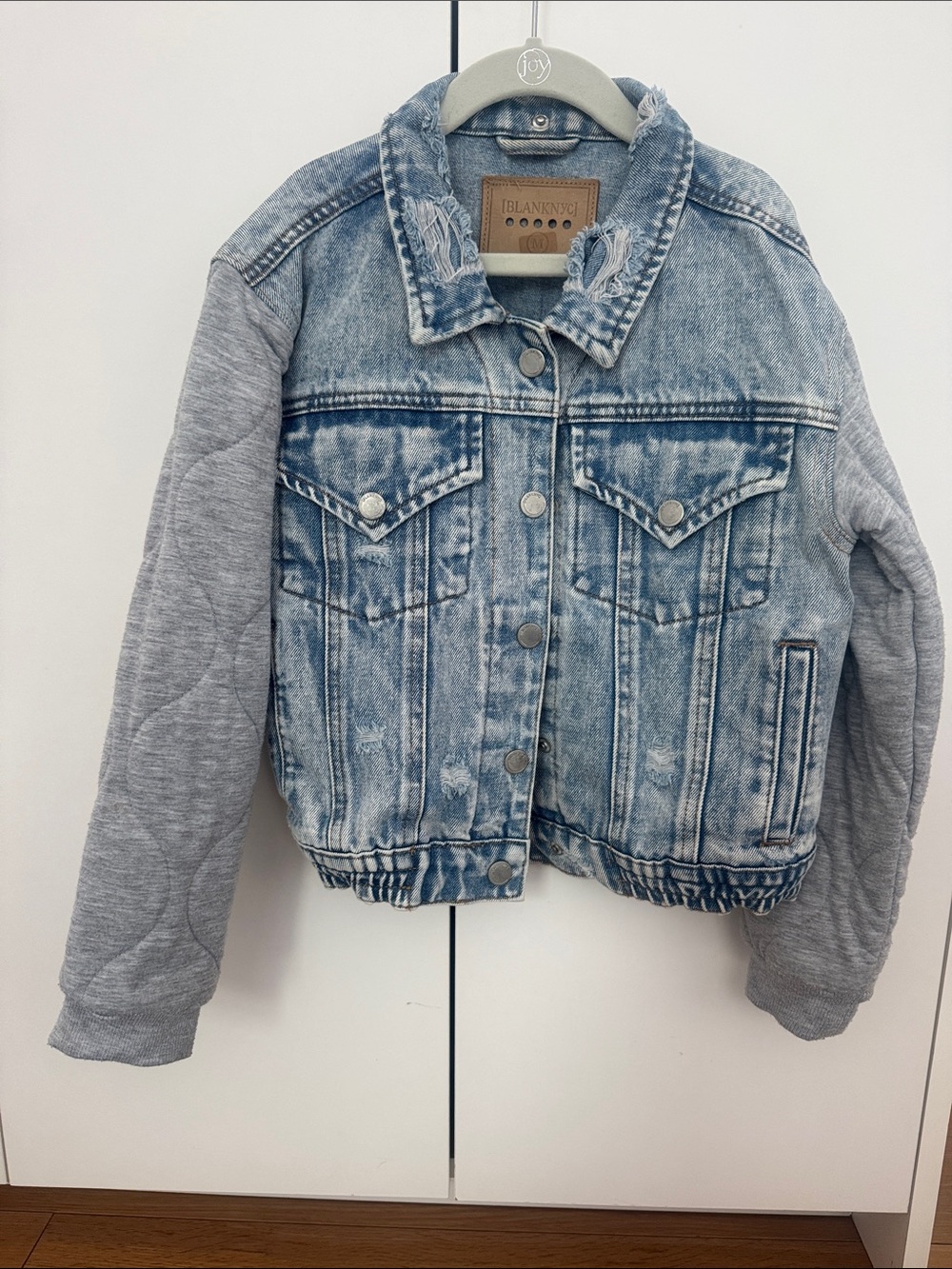 Blank NYC Light Blue Denim Jacket with Gray Knit Sleeves